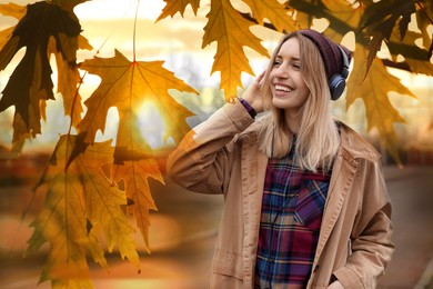 Image of Happy woman listening to sounds of nature which making her feel calm. Double exposure with tree branch
