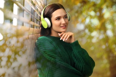 Image of Woman listening to sounds of nature which making her feel calm. Double exposure of room and tree