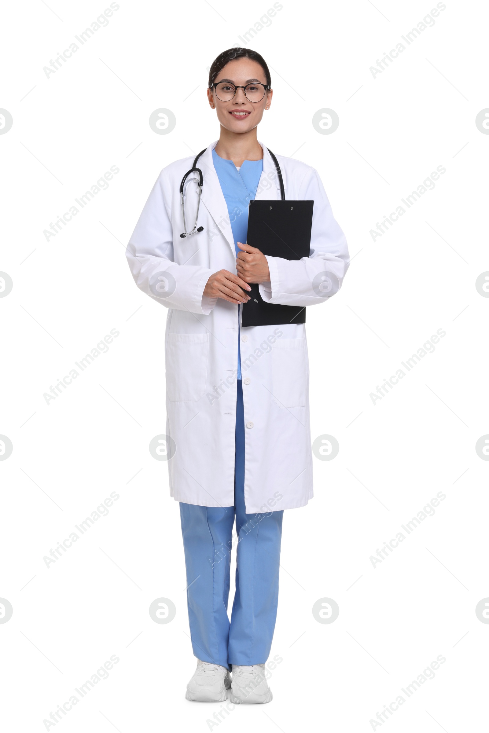 Smiling doctor in uniform, stethoscope and glasses with clipboard on white background Photo of Smiling doctor in uniform, stethoscope and glasses with clipboard on white background