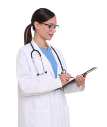 Photo of Smiling doctor in uniform, stethoscope and glasses writing on clipboard against white background
