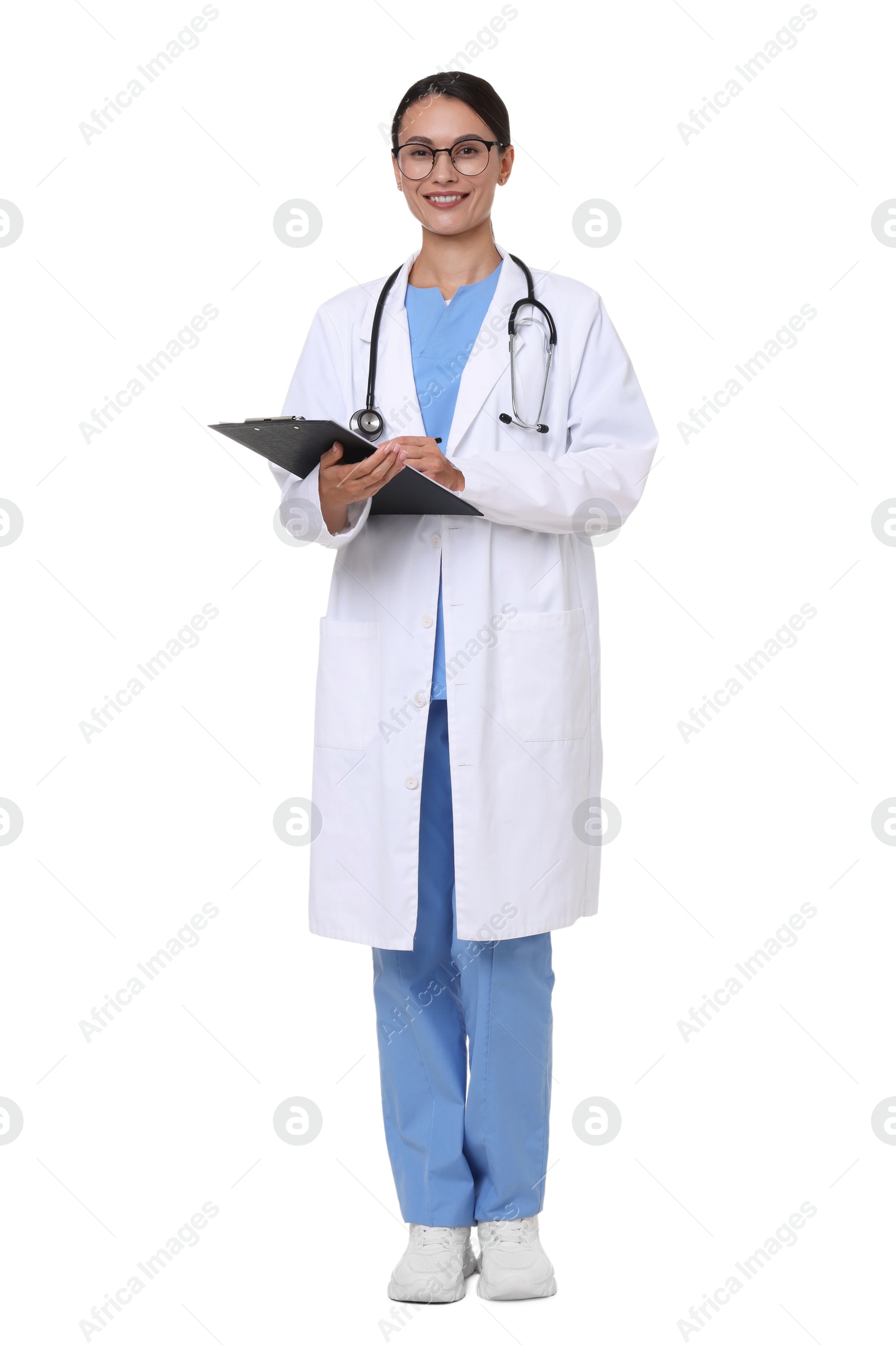 Smiling doctor in uniform and glasses with clipboard on white background Photo of Smiling doctor in uniform and glasses with clipboard on white background