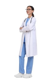 Photo of Smiling doctor in uniform, stethoscope and glasses with crossed arms on white background