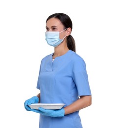 Photo of Nurse in uniform, medical mask and protective gloves with tray on white background