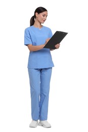 Photo of Nurse in uniform writing on clipboard against white background