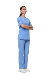 Photo of Smiling nurse in uniform with crossed arms on white background