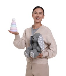 Photo of Smiling nursery teacher with toys on white background