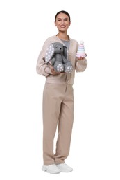 Photo of Smiling nursery teacher with toys on white background