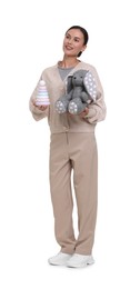 Photo of Smiling nursery teacher with toys on white background