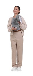 Photo of Smiling nursery teacher with toy rabbit on white background