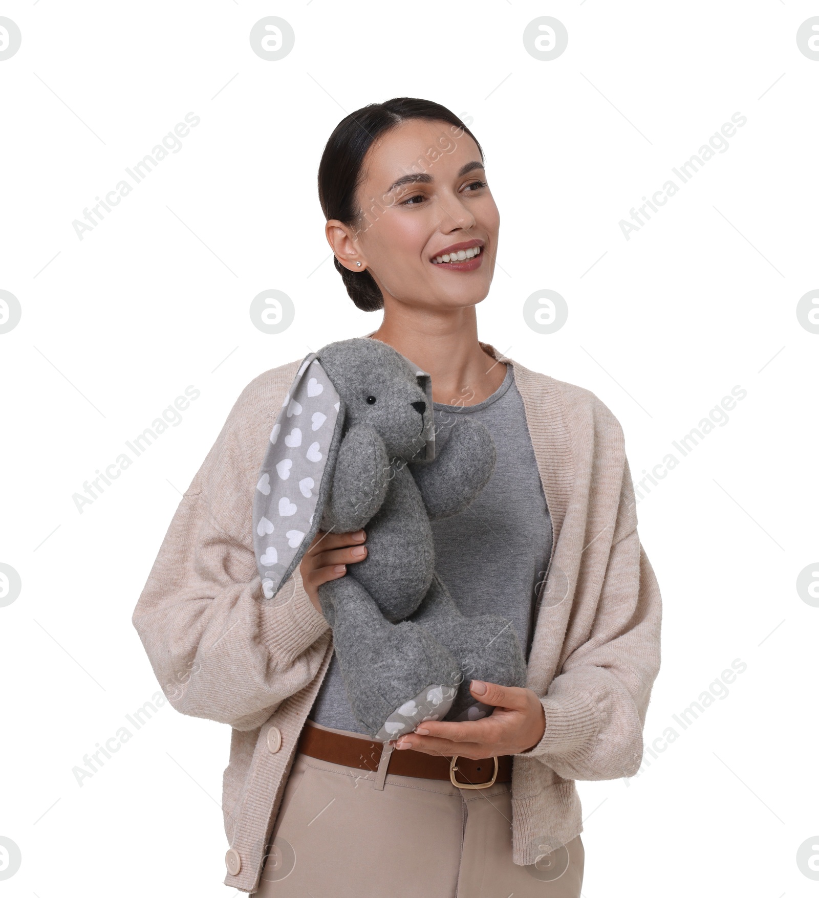 Smiling nursery teacher with toy rabbit on white background Photo of Smiling nursery teacher with toy rabbit on white background