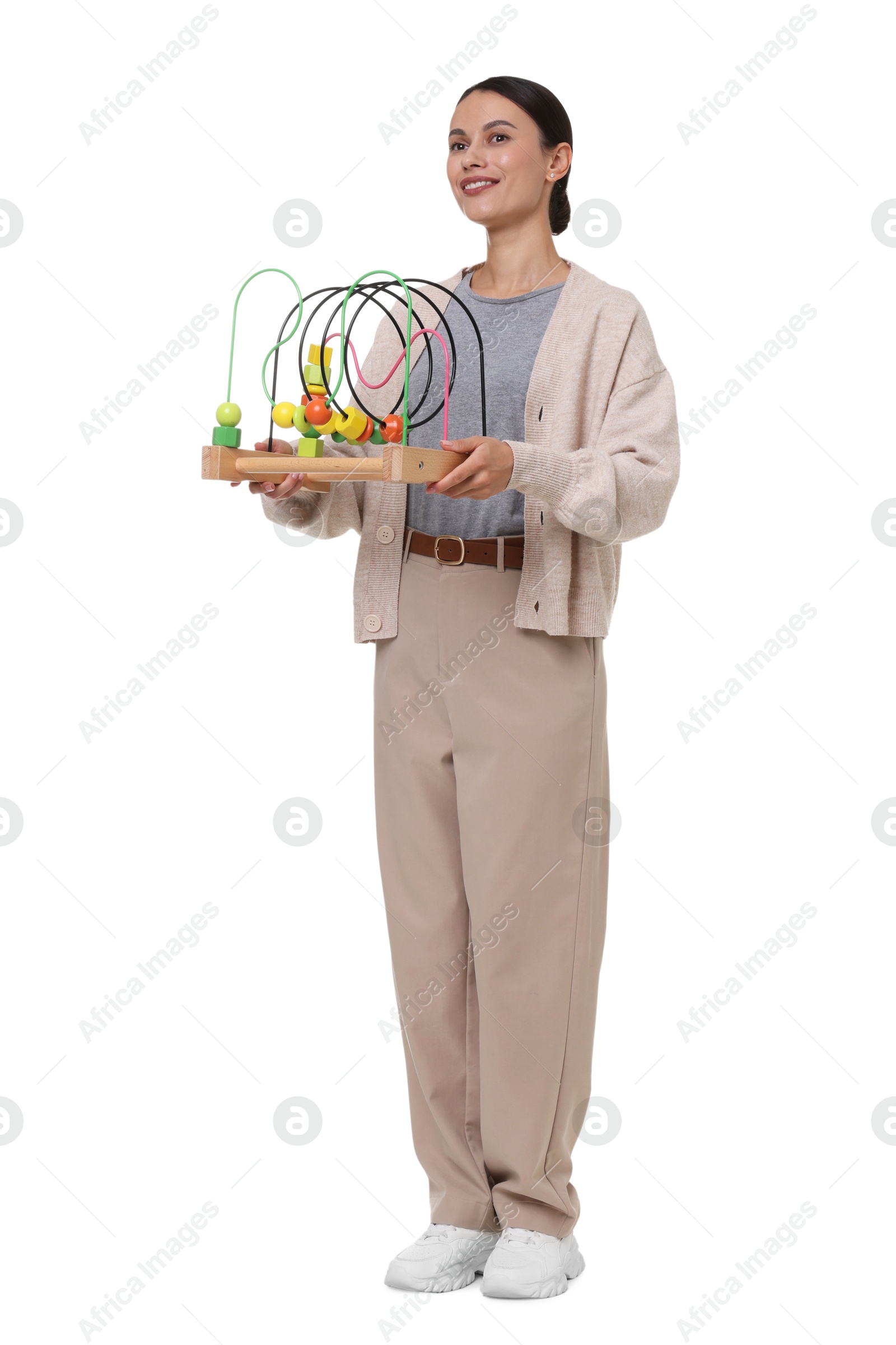 Smiling nursery teacher with educational toy on white background Photo of Smiling nursery teacher with educational toy on white background
