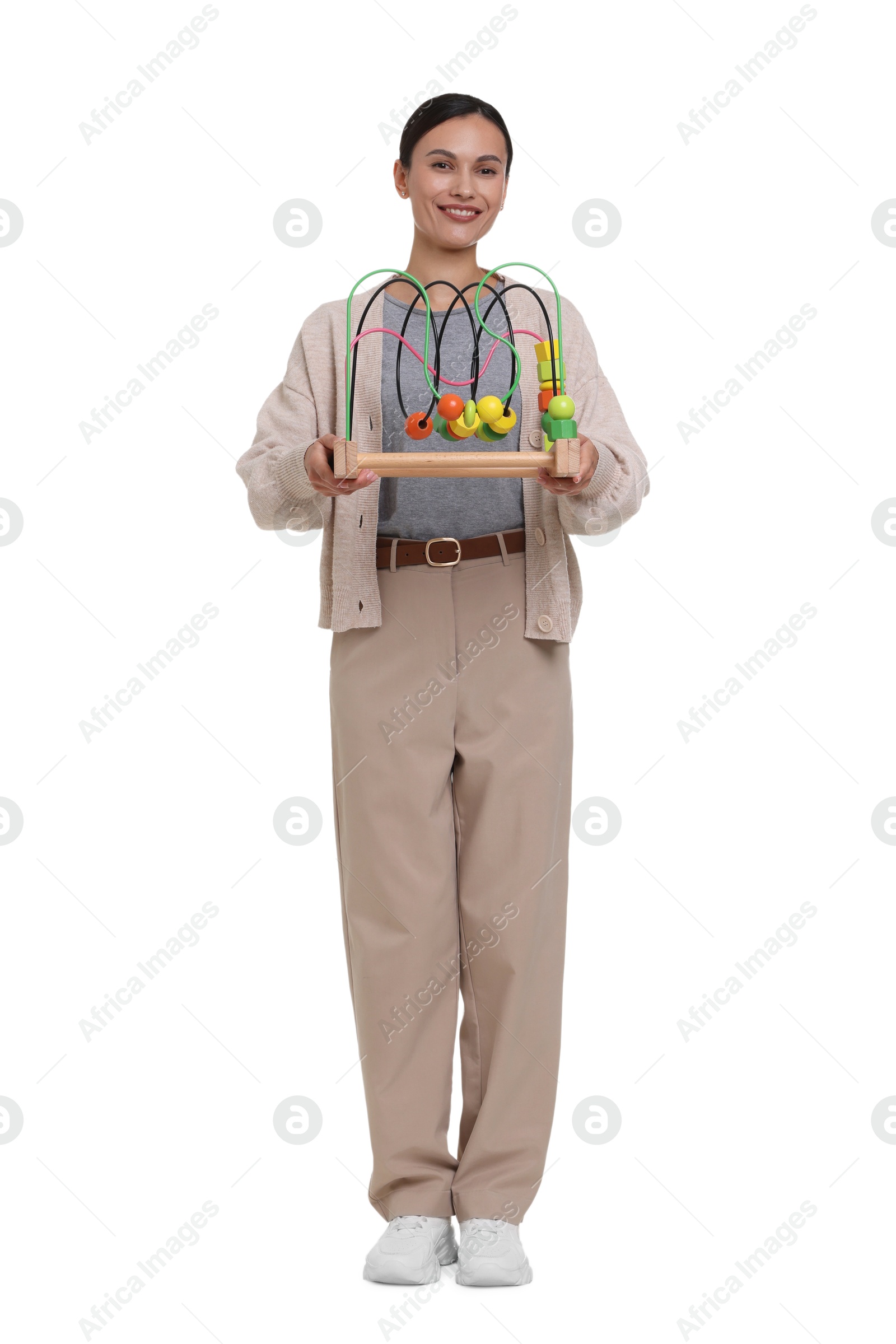 Smiling nursery teacher with educational toy on white background Photo of Smiling nursery teacher with educational toy on white background