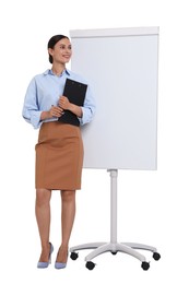 Photo of Smiling businesswoman with clipboard near flip chart on white background. Space for text