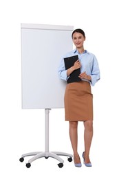 Photo of Smiling businesswoman with clipboard near flip chart on white background. Space for text