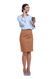 Photo of Smiling businesswoman with takeaway cup talking by smartphone on white background