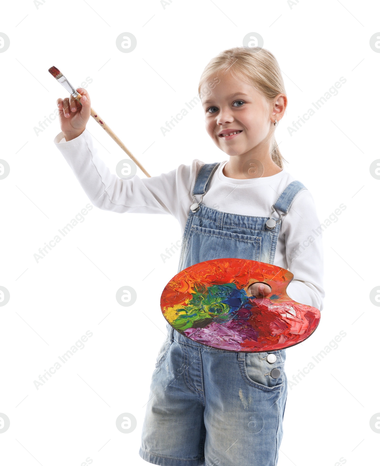 Photo of Choice of profession. Little girl with palette of paints and brush pretending to be artist on white background