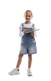 Photo of Choice of profession. Little girl with palette of paints and brush pretending to be artist on white background