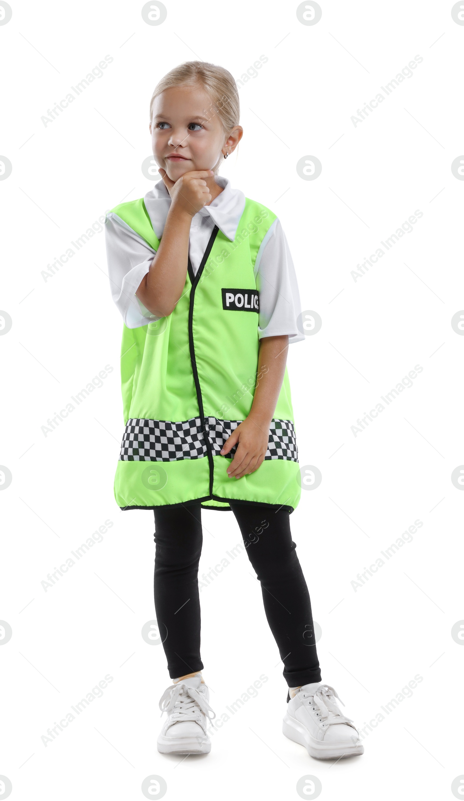 Photo of Choice of profession. Little girl in uniform pretending to be policewoman on white background