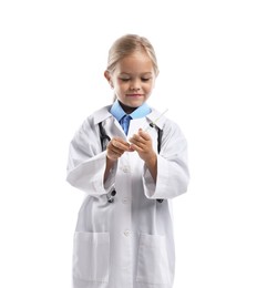 Photo of Choice of profession. Little girl with stethoscope and syringe pretending to be doctor on white background