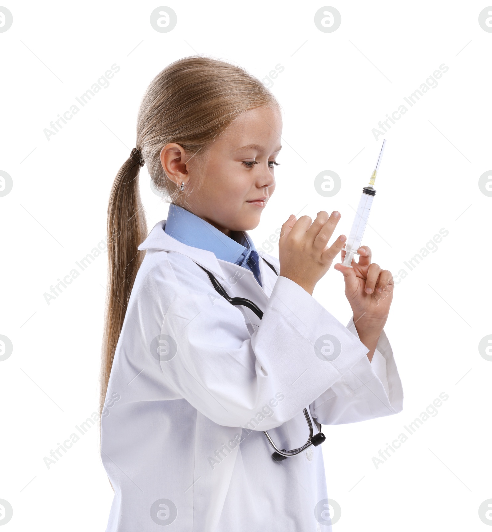 Photo of Choice of profession. Little girl with stethoscope and syringe pretending to be doctor on white background