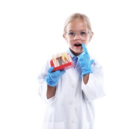Photo of Choice of profession. Little girl with dental model pretending to be dentist on white background