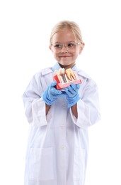 Photo of Choice of profession. Little girl with dental model pretending to be dentist on white background