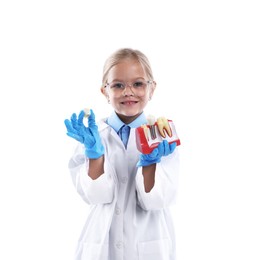 Photo of Choice of profession. Little girl with dental model pretending to be dentist on white background