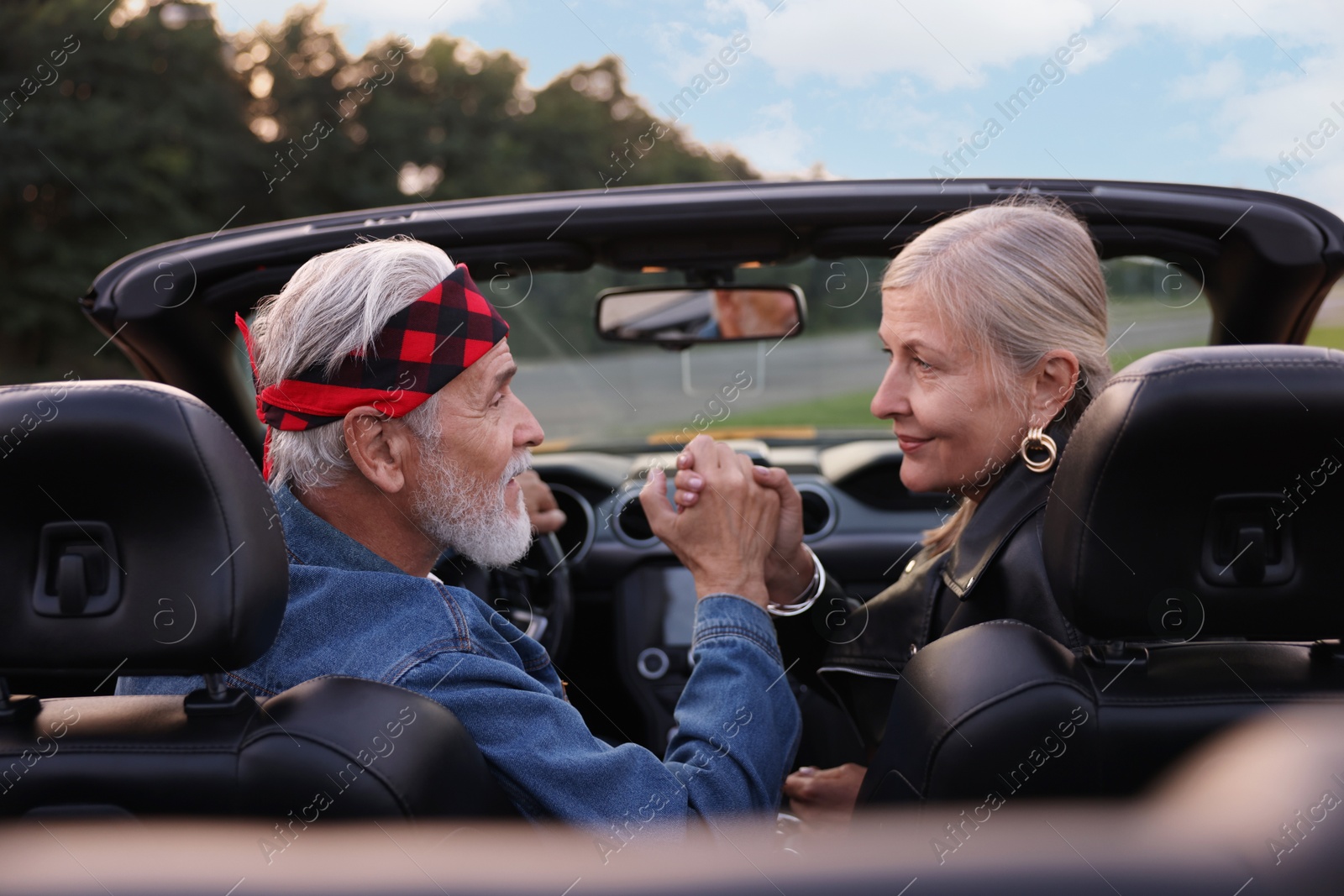 Photo of Stylish senior couple in modern cabriolet outdoors