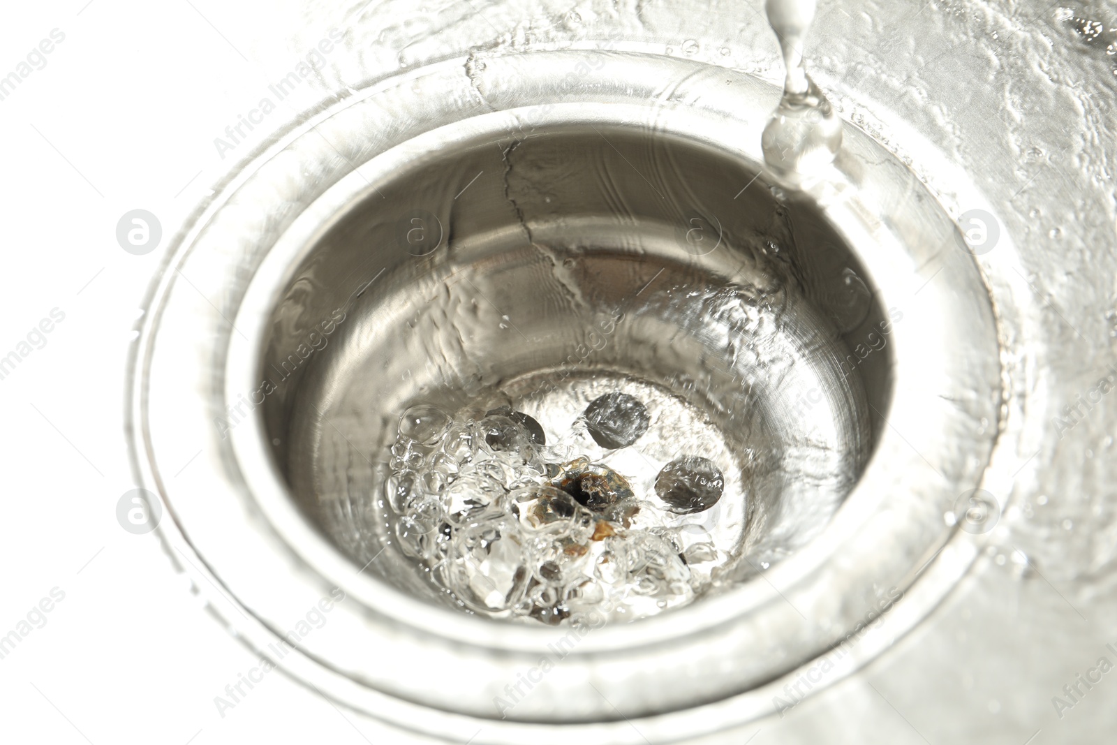 Water going down sink drain, closeup view Photo of Water going down sink drain, closeup view