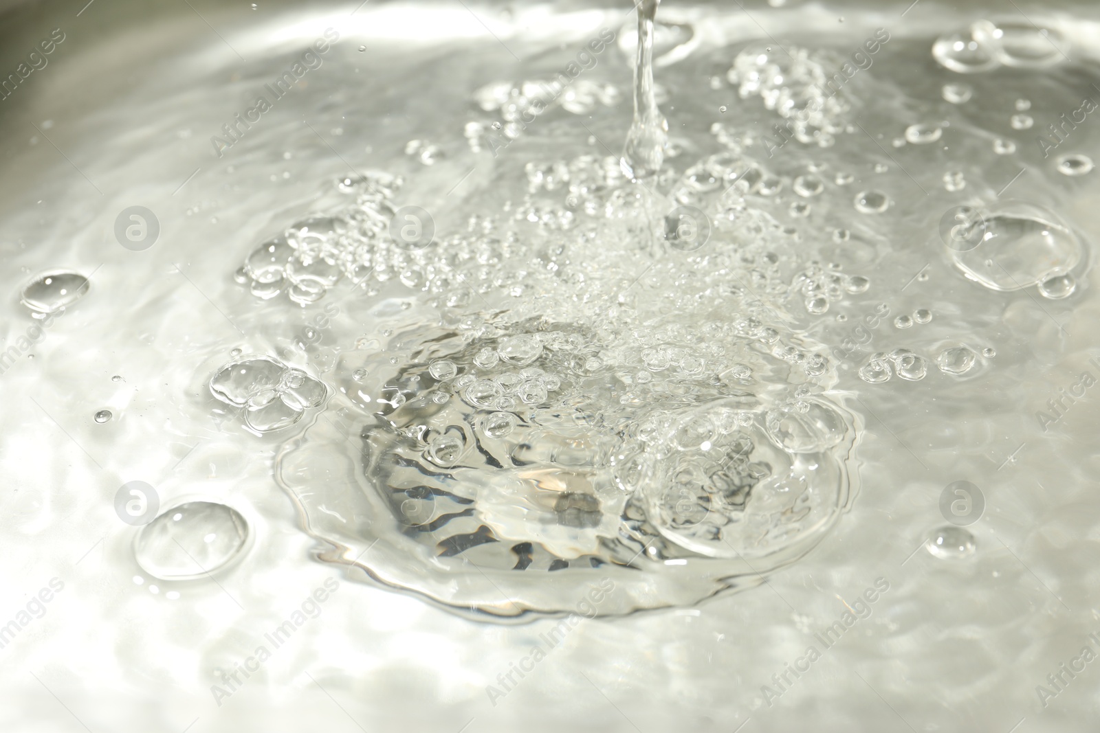 Water going down sink drain, closeup view Photo of Water going down sink drain, closeup view