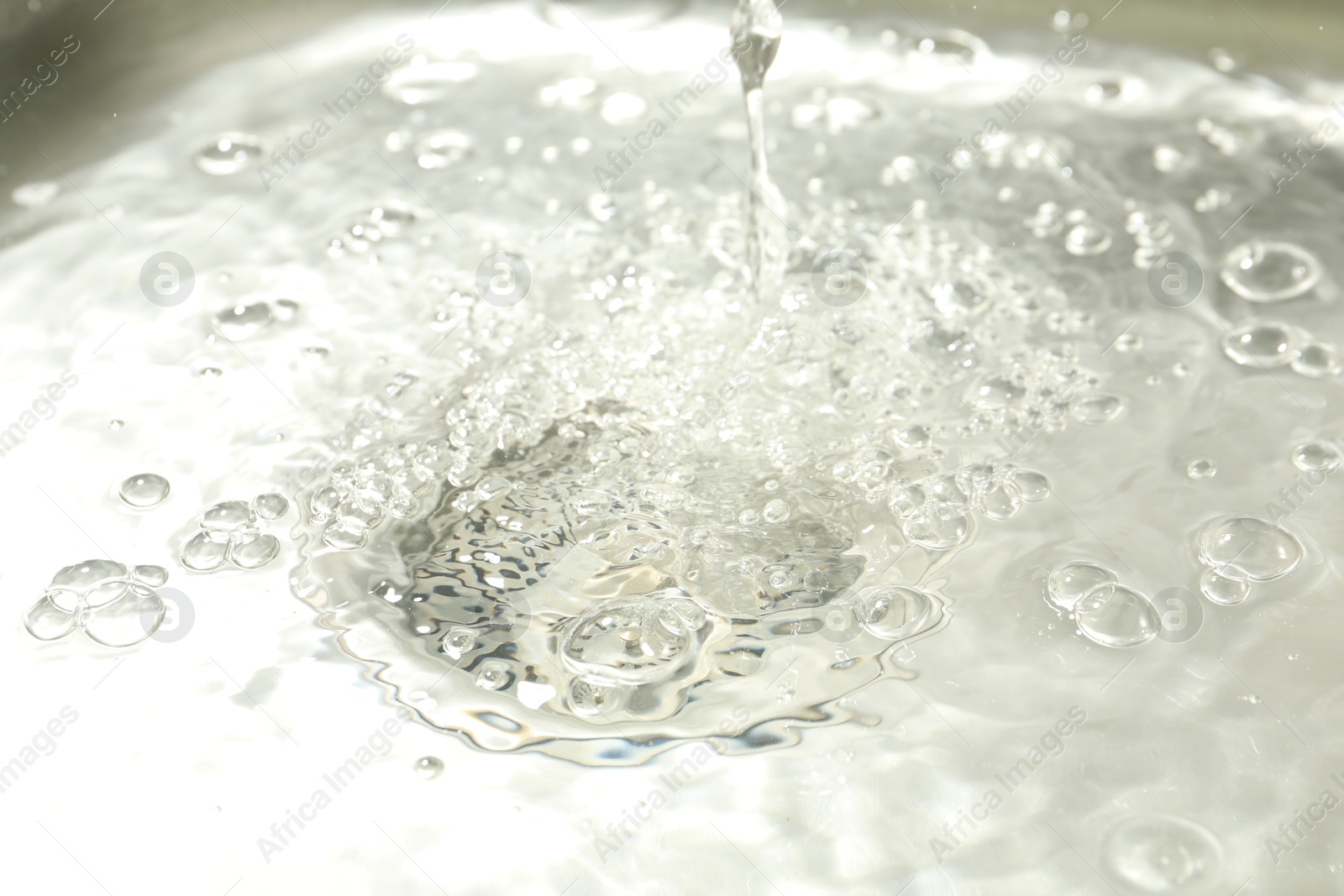 Water going down sink drain, closeup view Photo of Water going down sink drain, closeup view