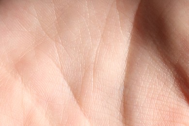 Photo of Macro view of human palm skin as background