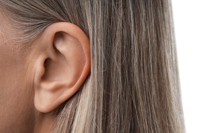 Photo of Sound. Senior woman on white background, closeup