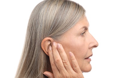 Photo of Sound. Senior woman touching her ear on white background