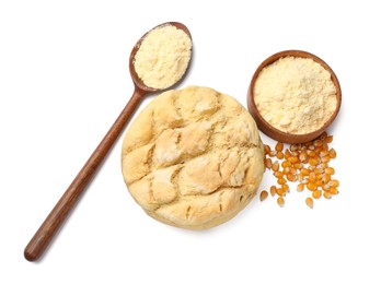 Photo of Freshly baked cornbread loaf, flour and seeds isolated on white, top view
