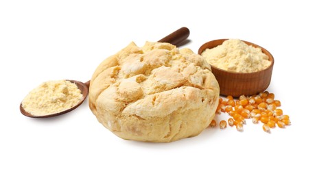 Photo of Freshly baked cornbread loaf, flour and seeds isolated on white