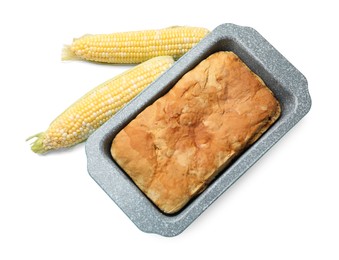 Photo of Freshly baked cornbread loaf and cobs isolated on white, top view