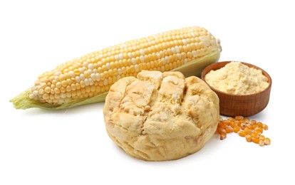 Photo of Freshly baked cornbread loaf, flour, cob and seeds isolated on white