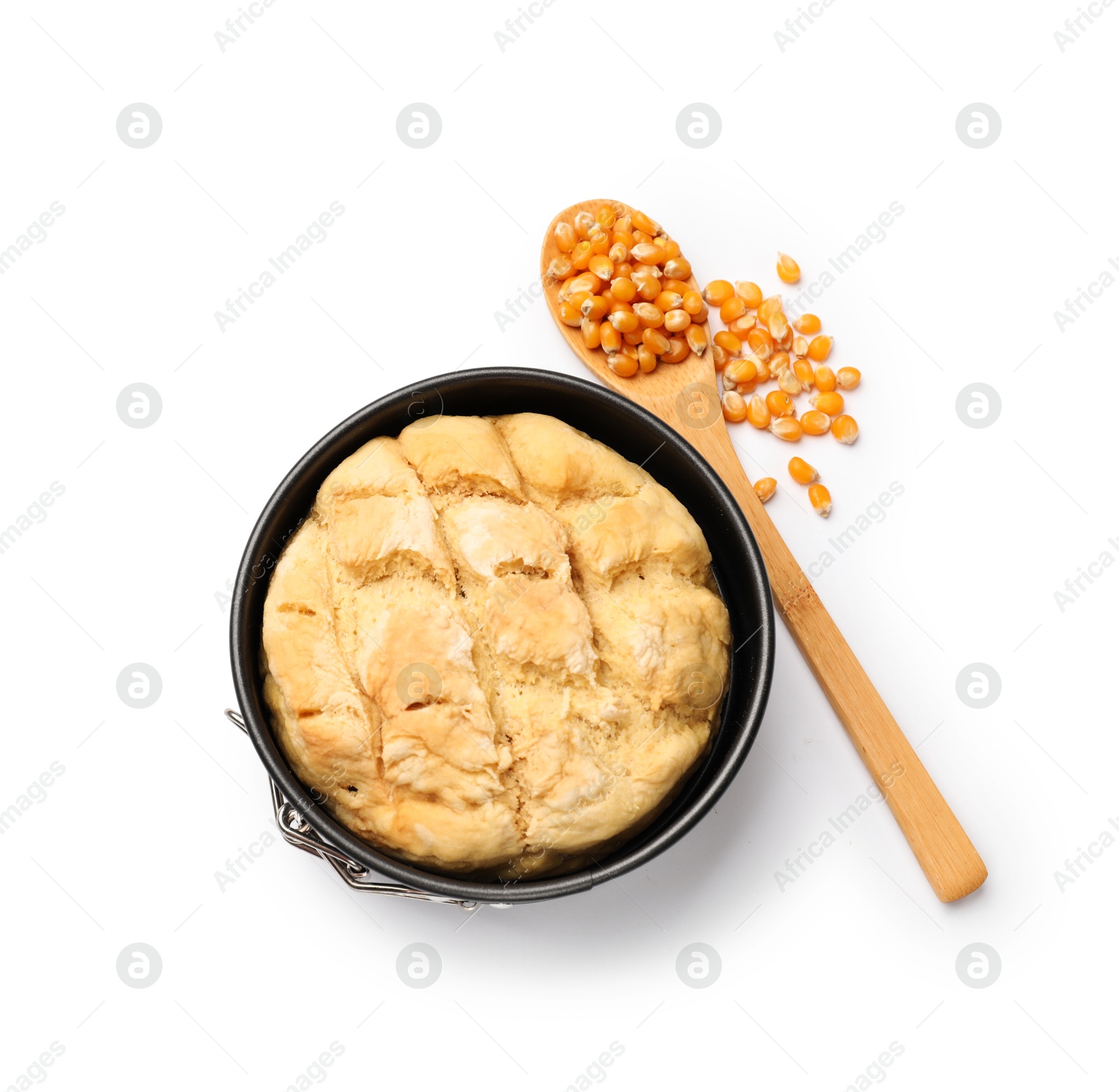 Freshly baked cornbread loaf and seeds isolated on white, top view Photo of Freshly baked cornbread loaf and seeds isolated on white, top view