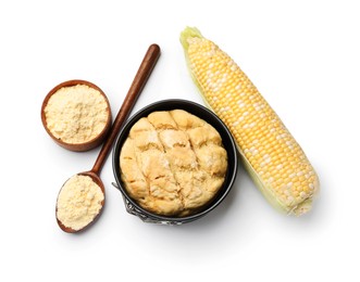 Photo of Freshly baked cornbread loaf, flour and cob isolated on white, top view