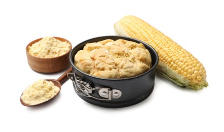Photo of Freshly baked cornbread loaf, flour and cob isolated on white