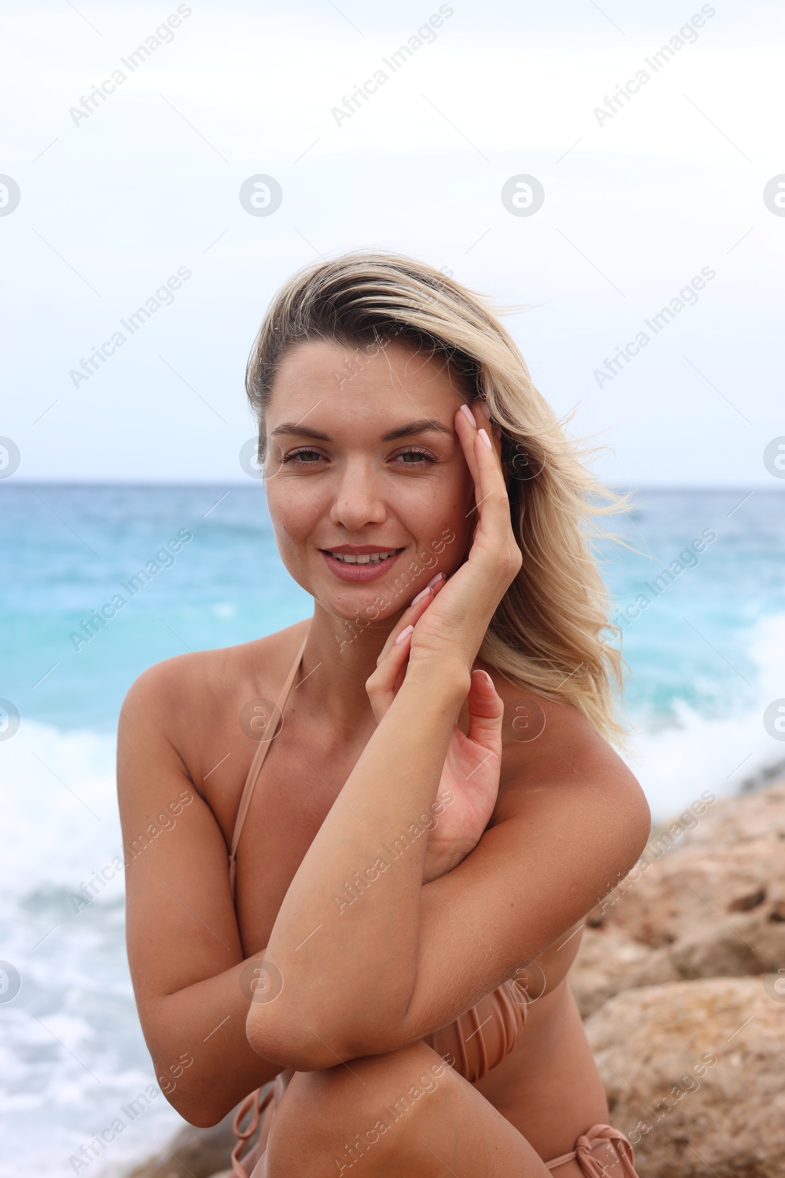 Photo of Beautiful woman wearing stylish bikini on beach
