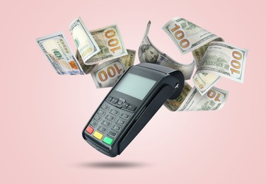 Image of Payment terminal and dollars in air on pink background
