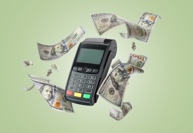 Image of Payment terminal and dollars in air on pale green background
