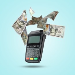 Image of Payment terminal and dollars in air on light blue background
