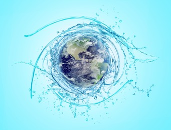 Image of Save water concept. Earth surrounded by splashing water against light blue background