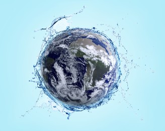 Image of Save water concept. Earth surrounded by splashing water against light blue background