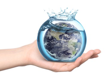 Image of Save water concept. Earth inside aquarium bowl with splashing water in woman's hand against white background