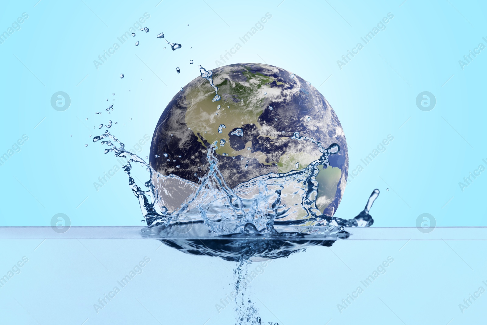 Image of Save water concept. Earth falling into water against light blue background
