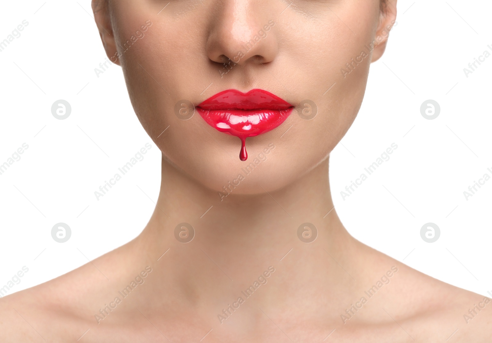 Image of Red liquid lipstick dripping from woman's lip against white background, closeup
